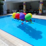 Colourful outdoors pool balloon decorations